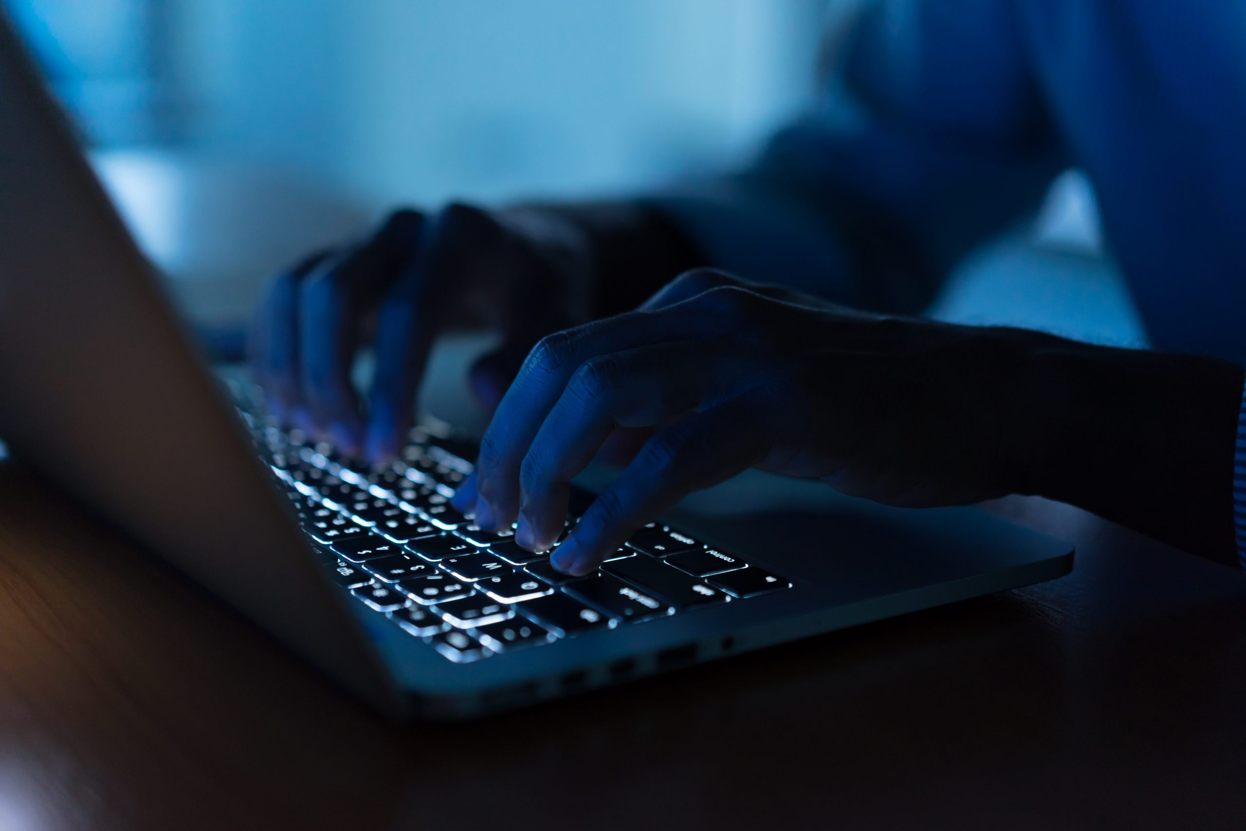 man hand typing keyboard input code for register system